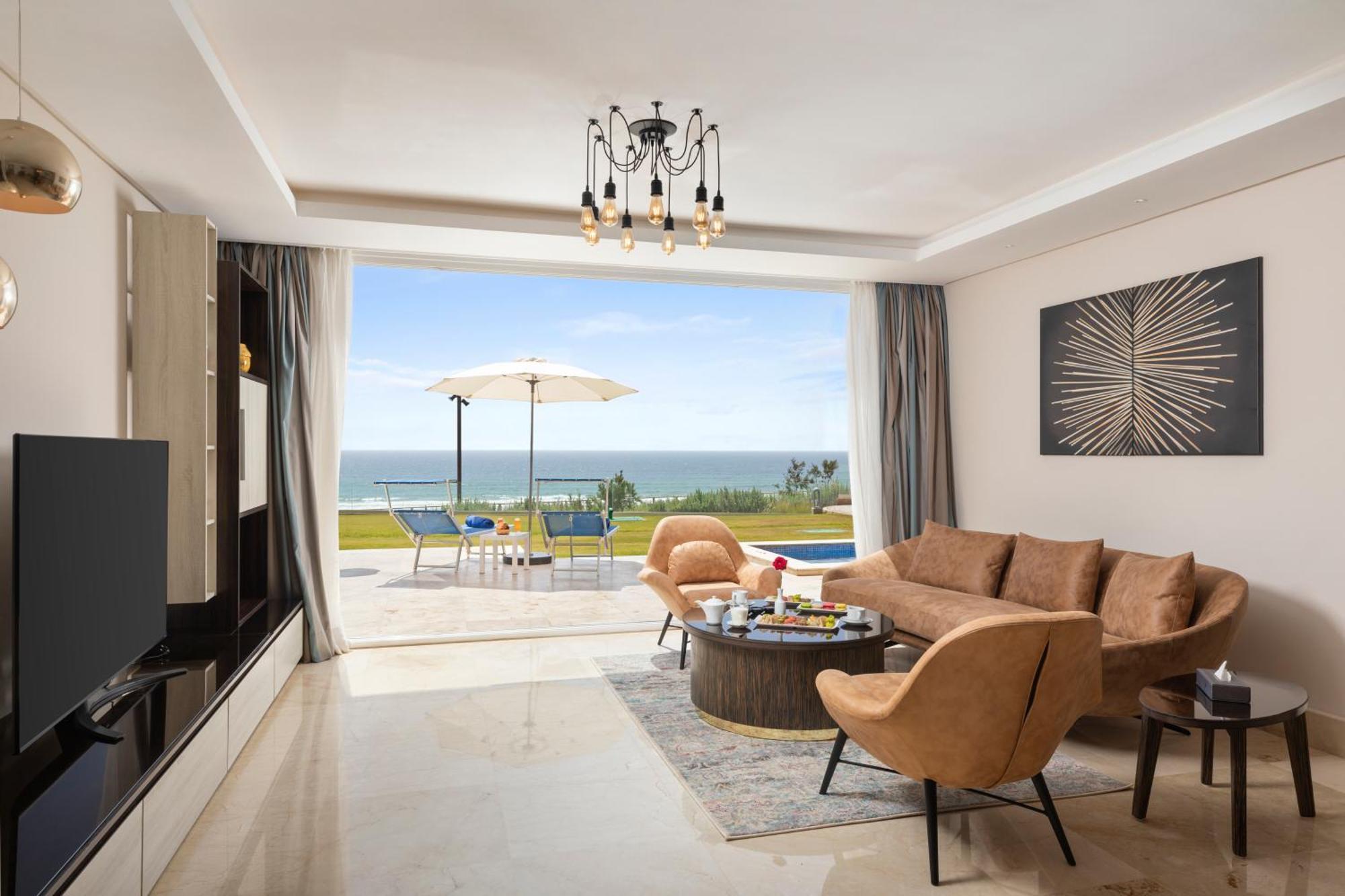 Pickalbatros White Beach Taghazout (Adults Only) Exterior foto A living room in a villa at the resort